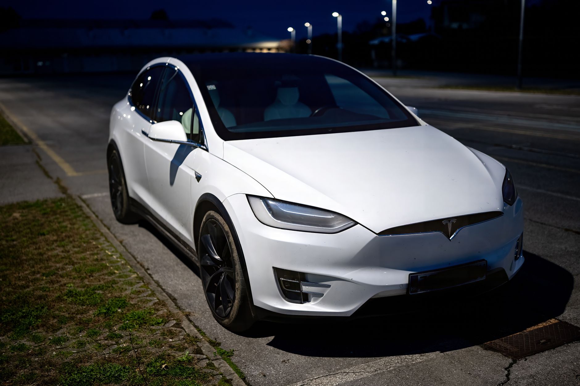 night photo of a white car